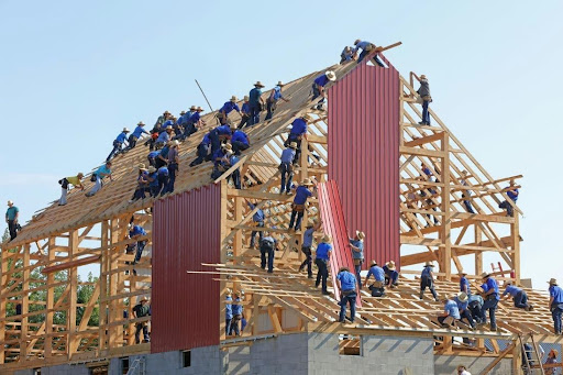 workers on wooden scaffolding